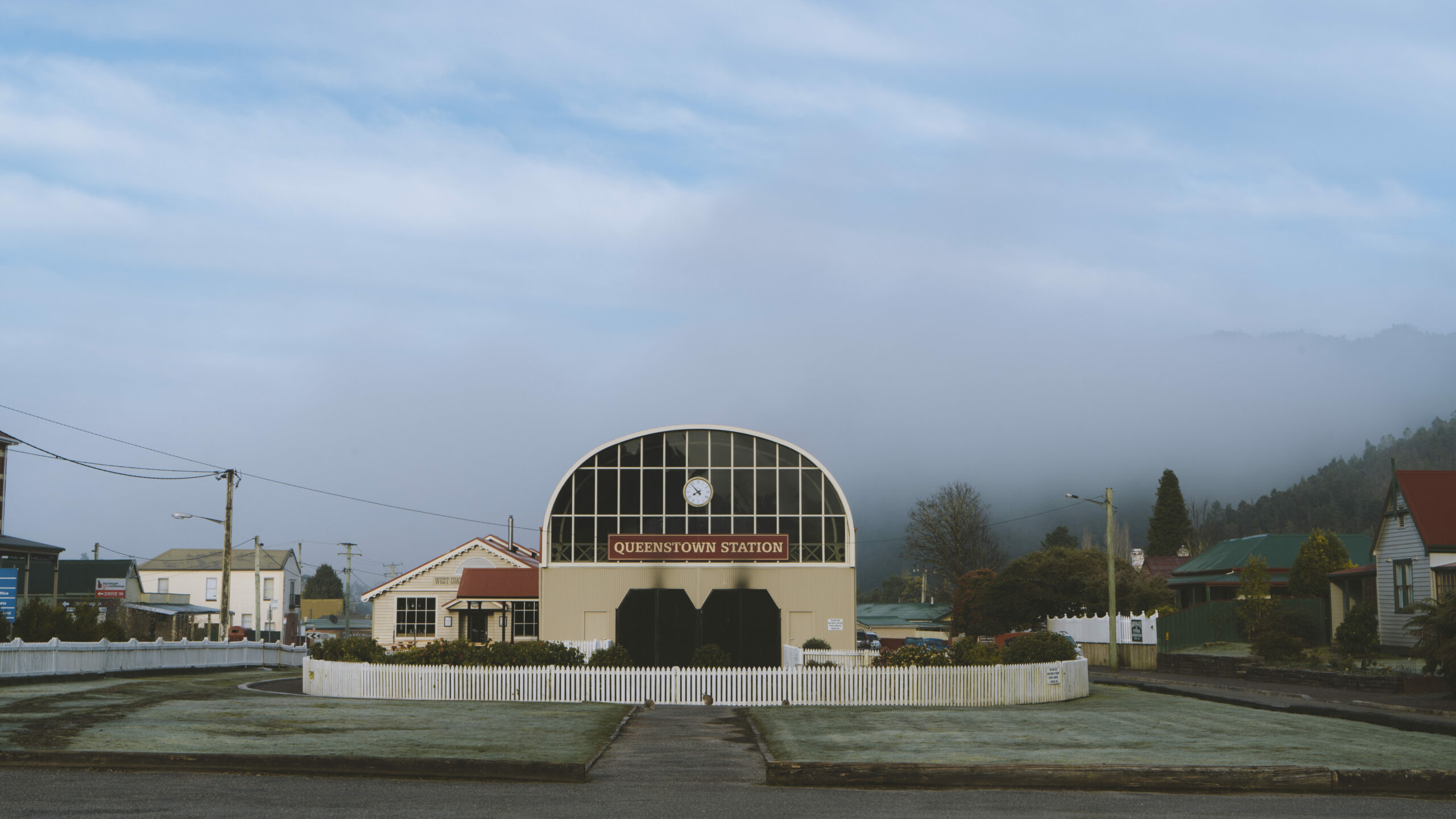 View of Queenstown Station from the car park with two large doors and dome shaped roof